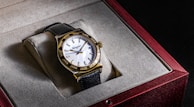 a watch sitting in a box on top of a table