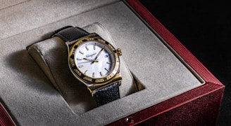 a watch sitting in a box on top of a table