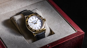a watch sitting in a box on top of a table