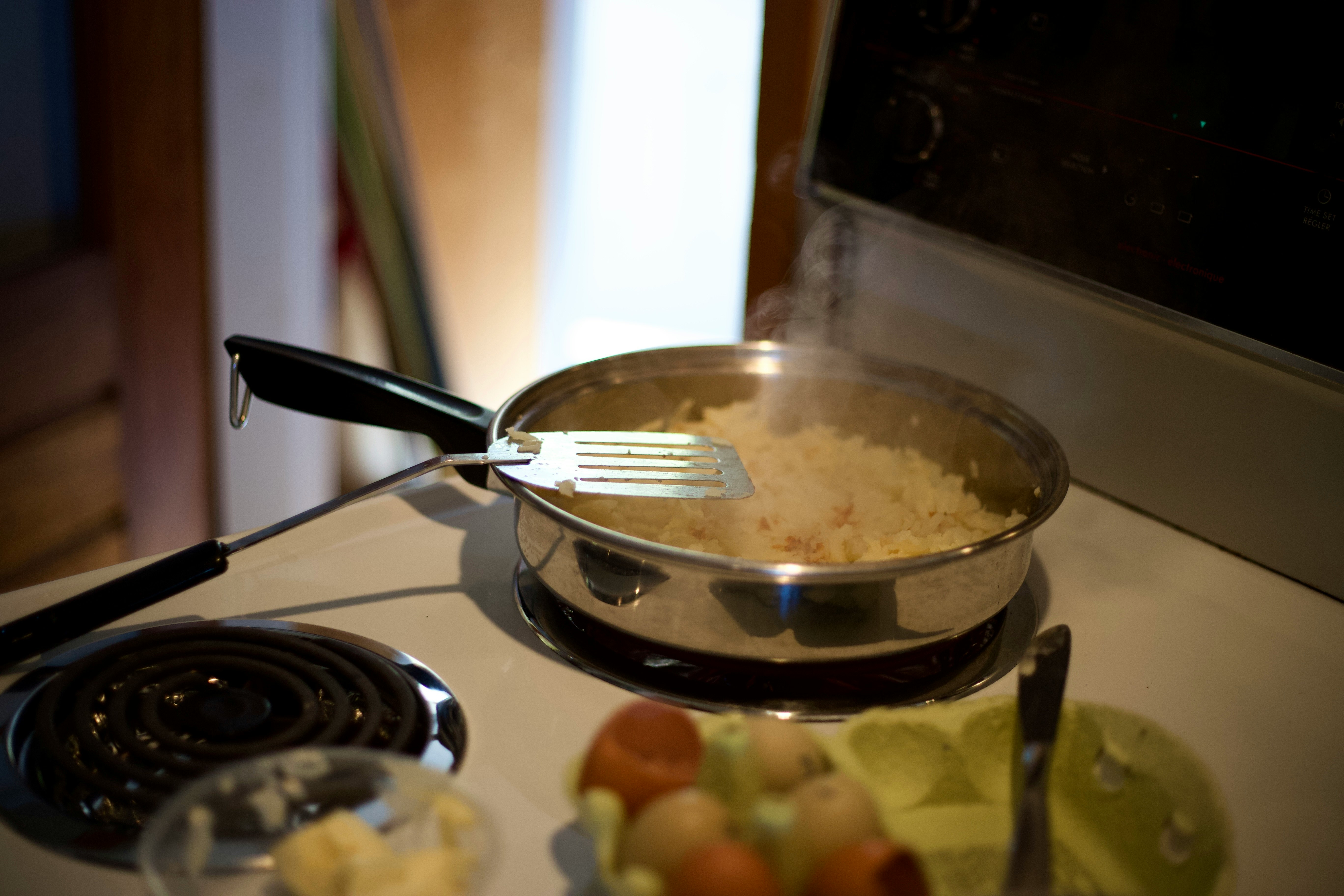 stainless steel fork on black frying pan