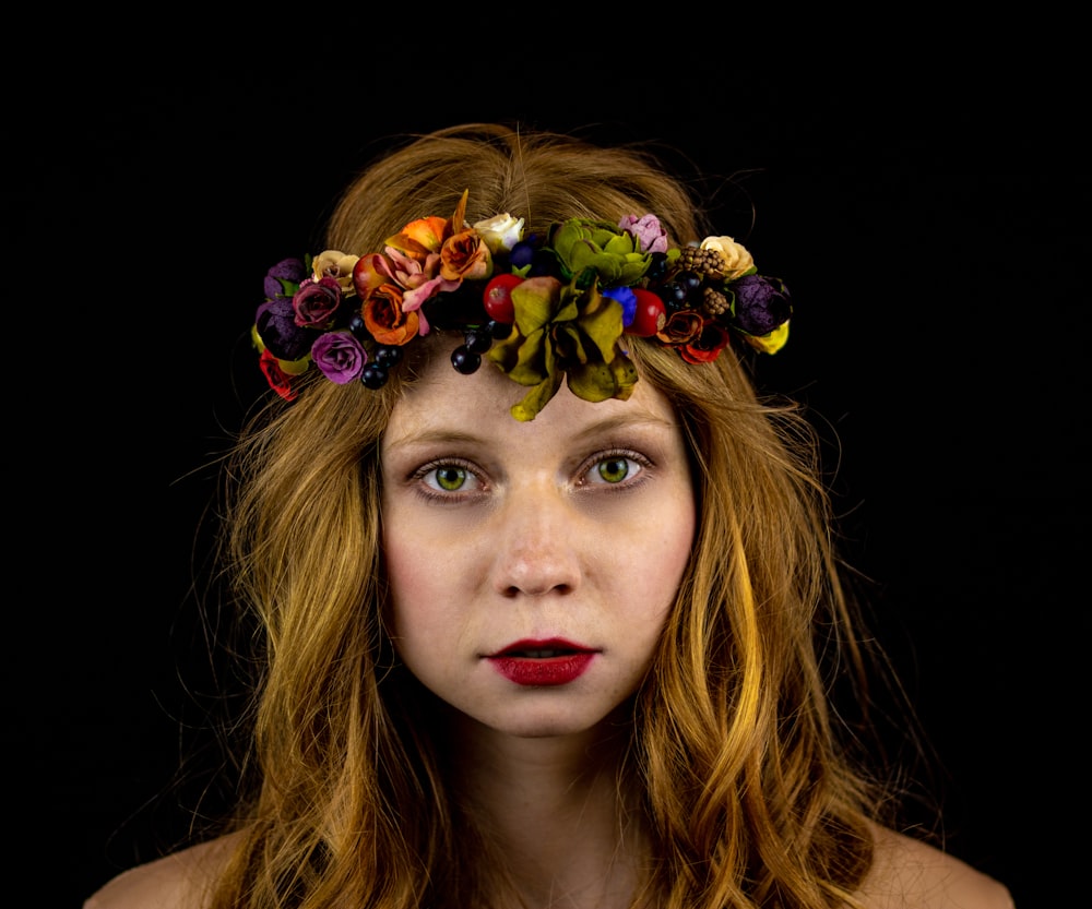 a woman with a flower crown on her head