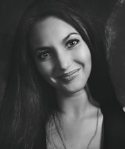 A welcoming image of a woman smiling, symbolizing open communication.