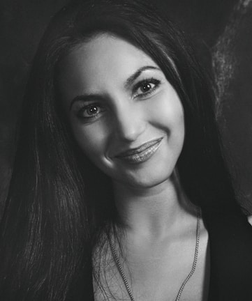 A professional portrait of a smiling businesswoman.