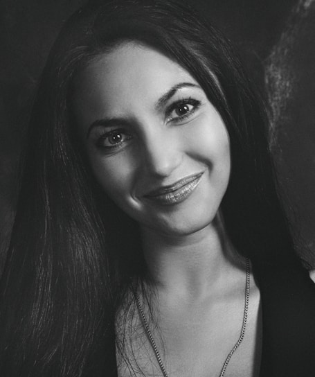 A portrait of Jocelyn Blackwell, smiling confidently.