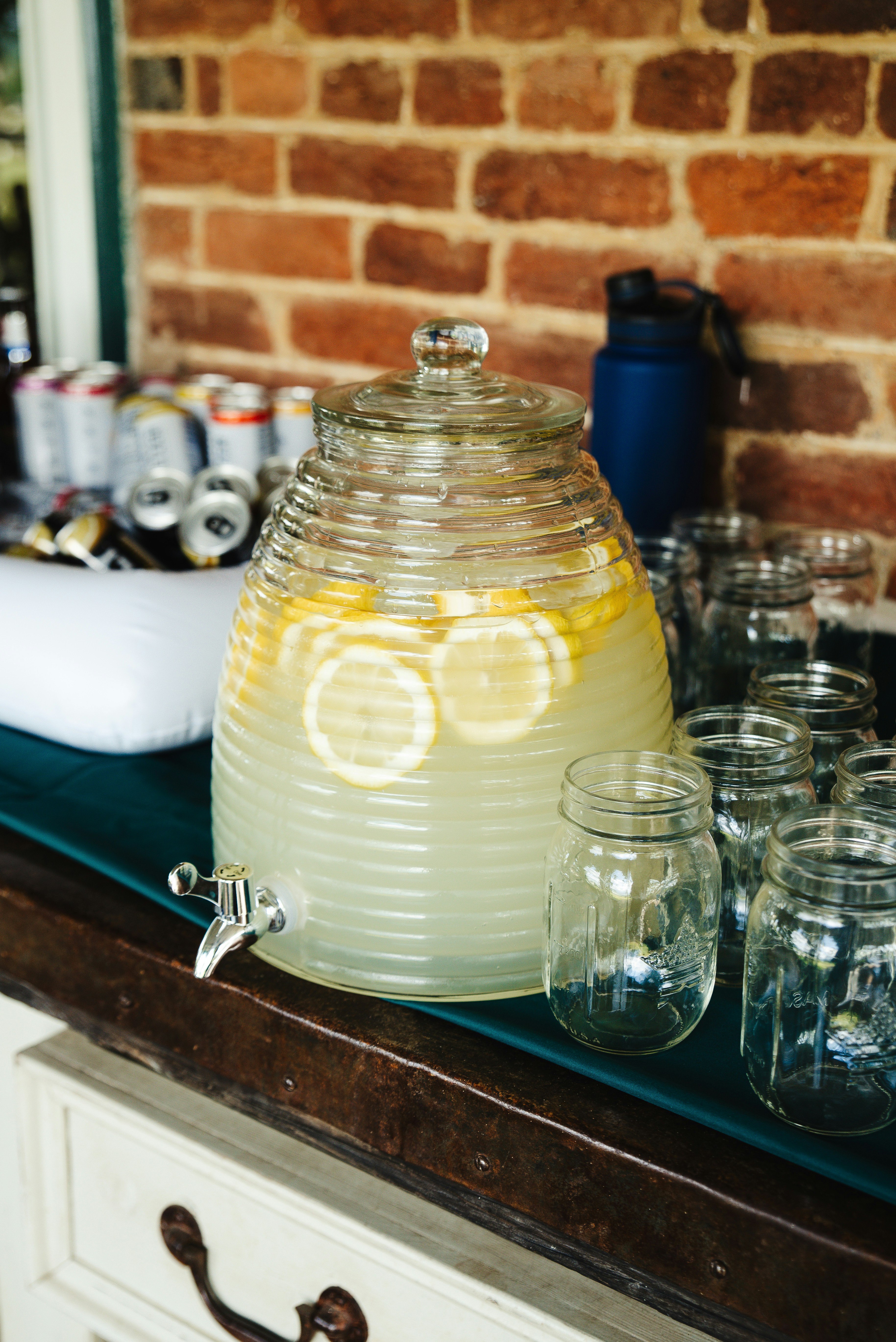 a pitcher of lemonade sitting on top of a counter