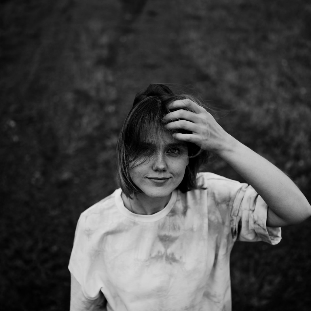 grayscale photo of girl in crew neck t-shirt