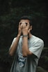 a man covering his eyes with his hands