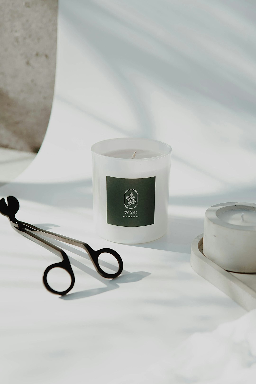 black and silver scissors beside white ceramic round bowl