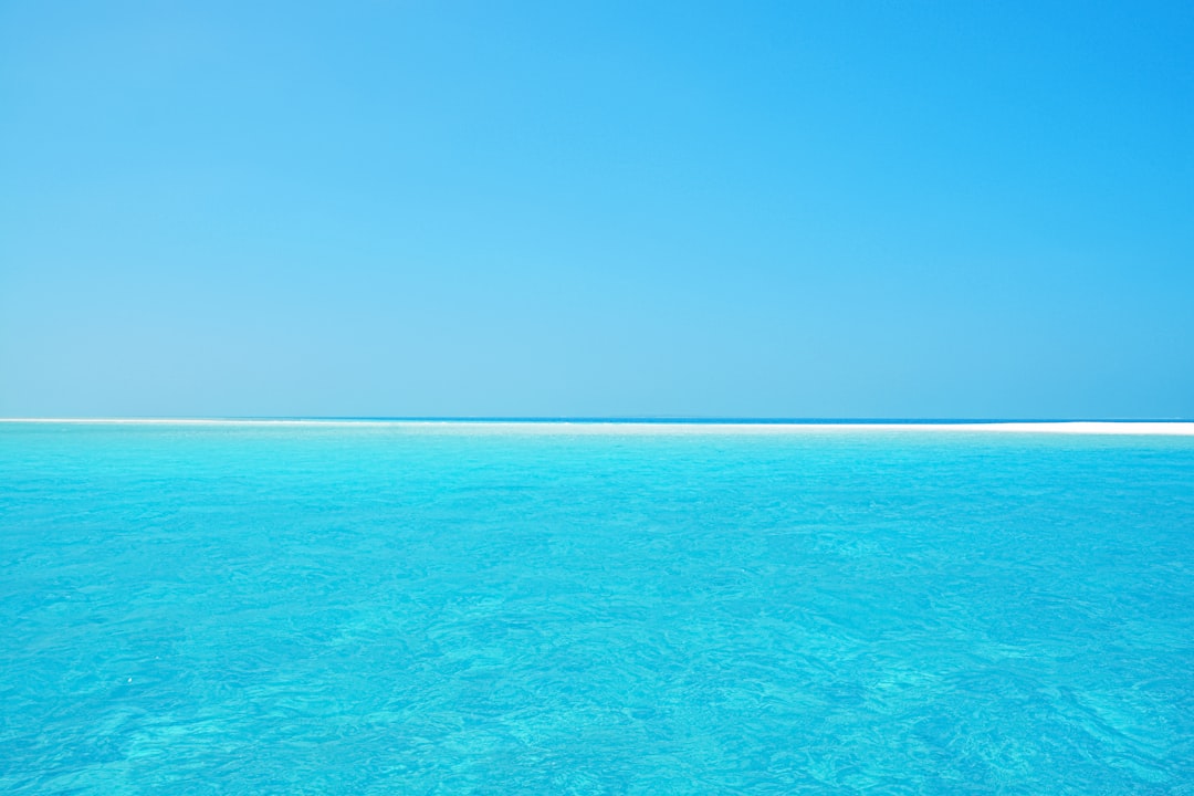 blue sea under blue sky during daytime