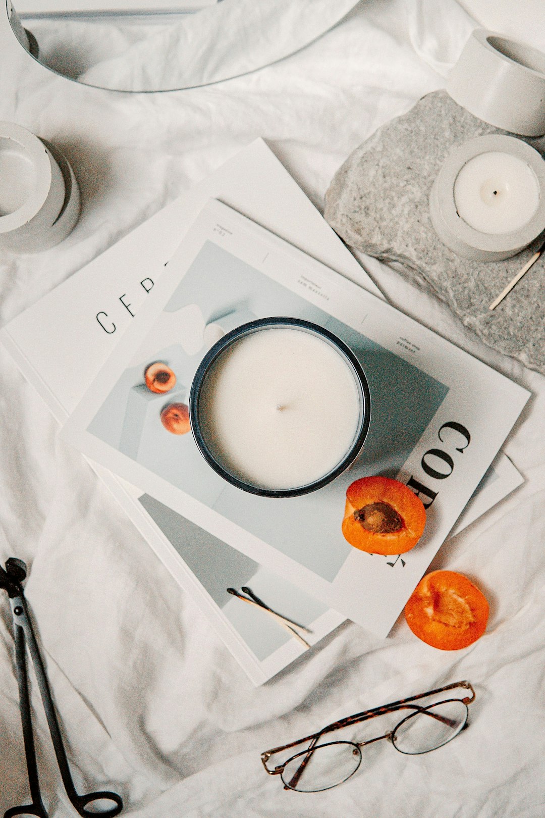 white ceramic cup with saucer on white paper