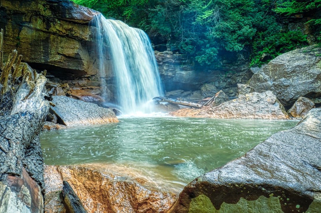 water falls on rocky river,