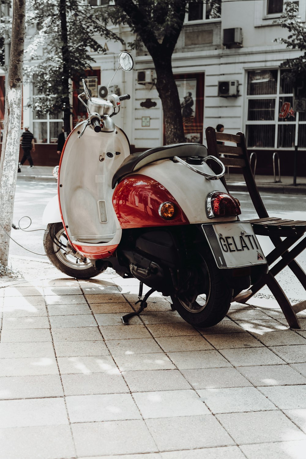 a scooter is parked on the side of the street