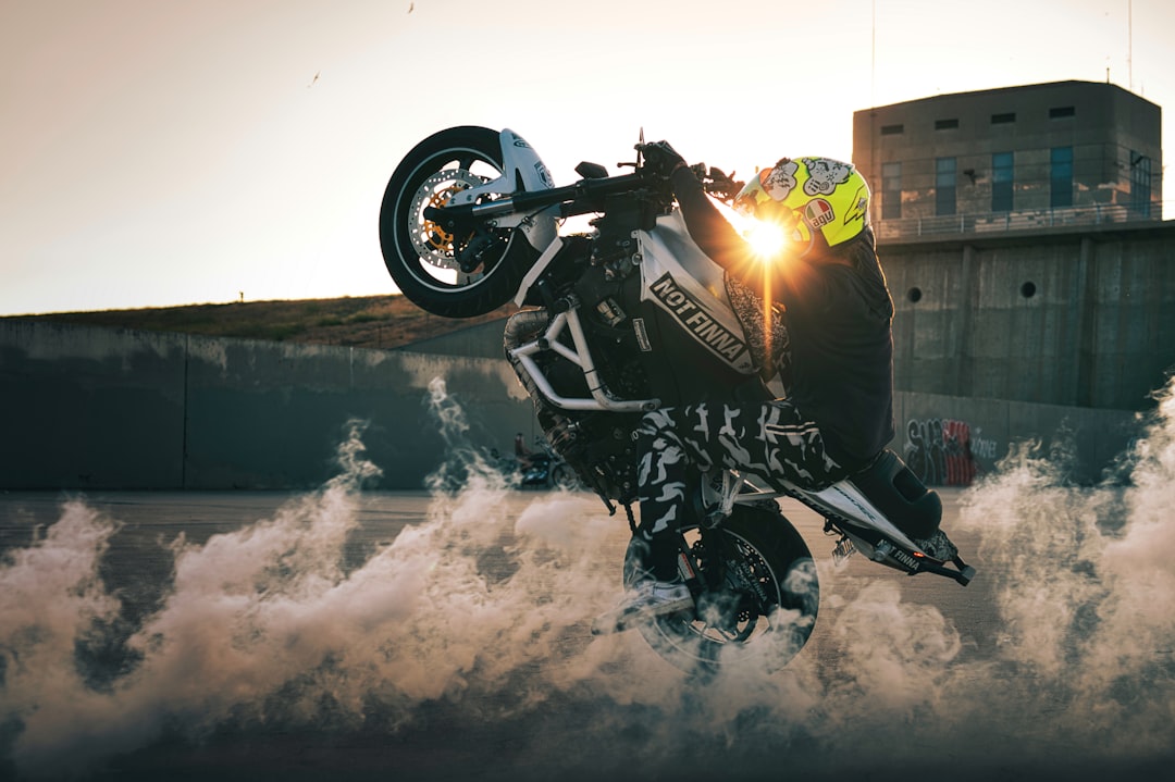 black and yellow sports bike parked on snow covered ground during daytime