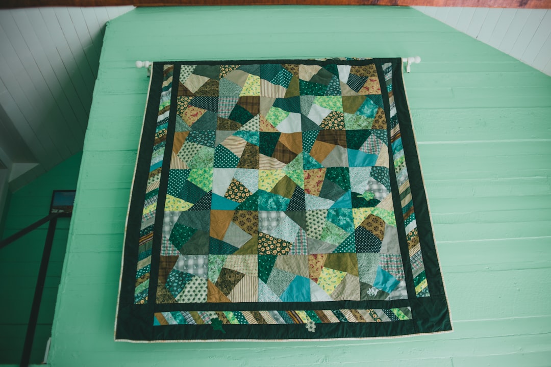  blue green and white textile quilt