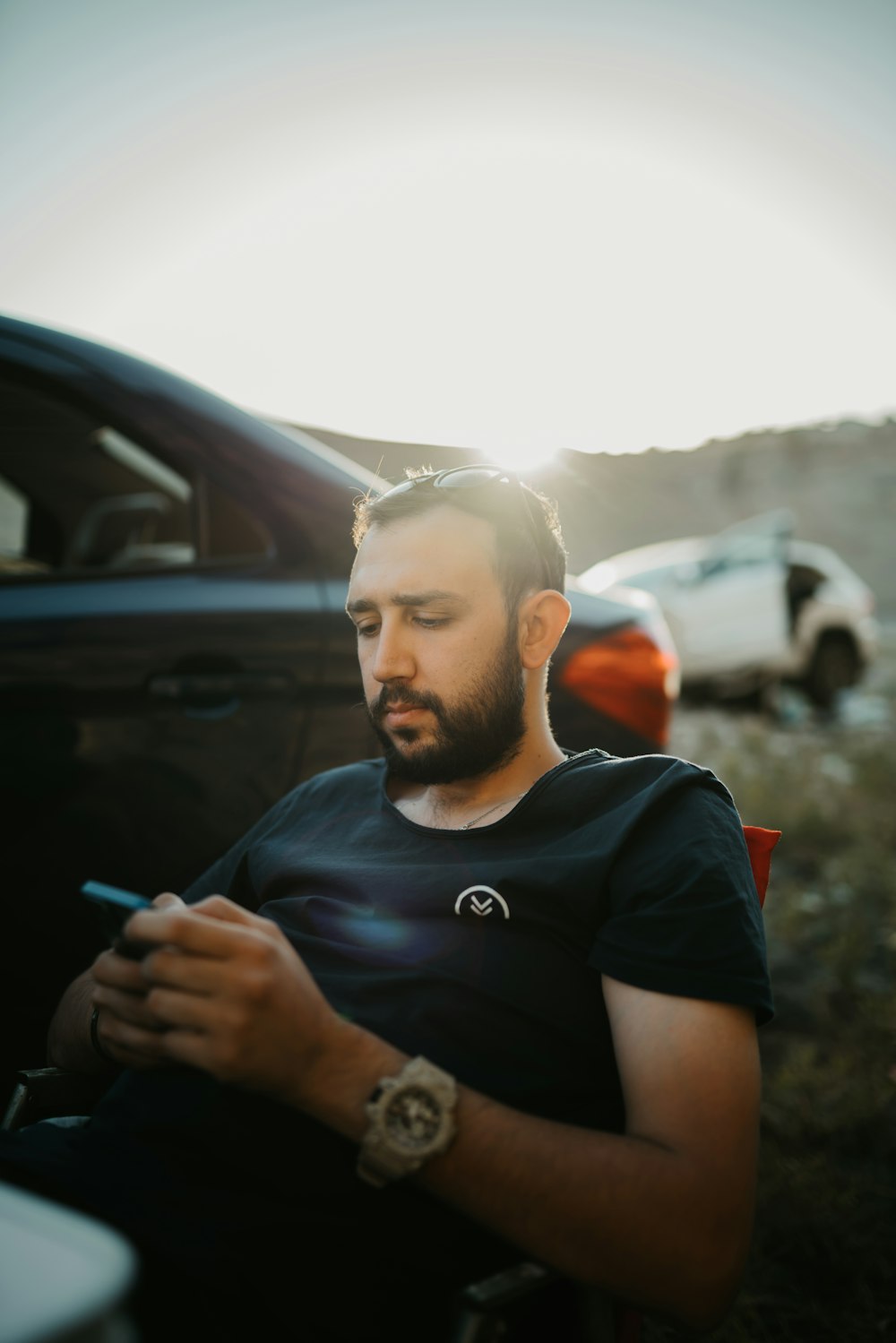 man in black crew neck t-shirt smoking cigarette