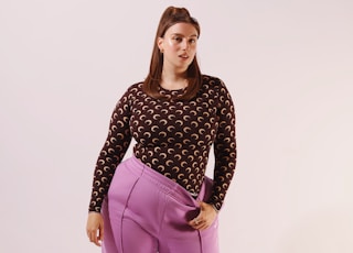 woman in black and white polka dot long sleeve shirt and pink pants