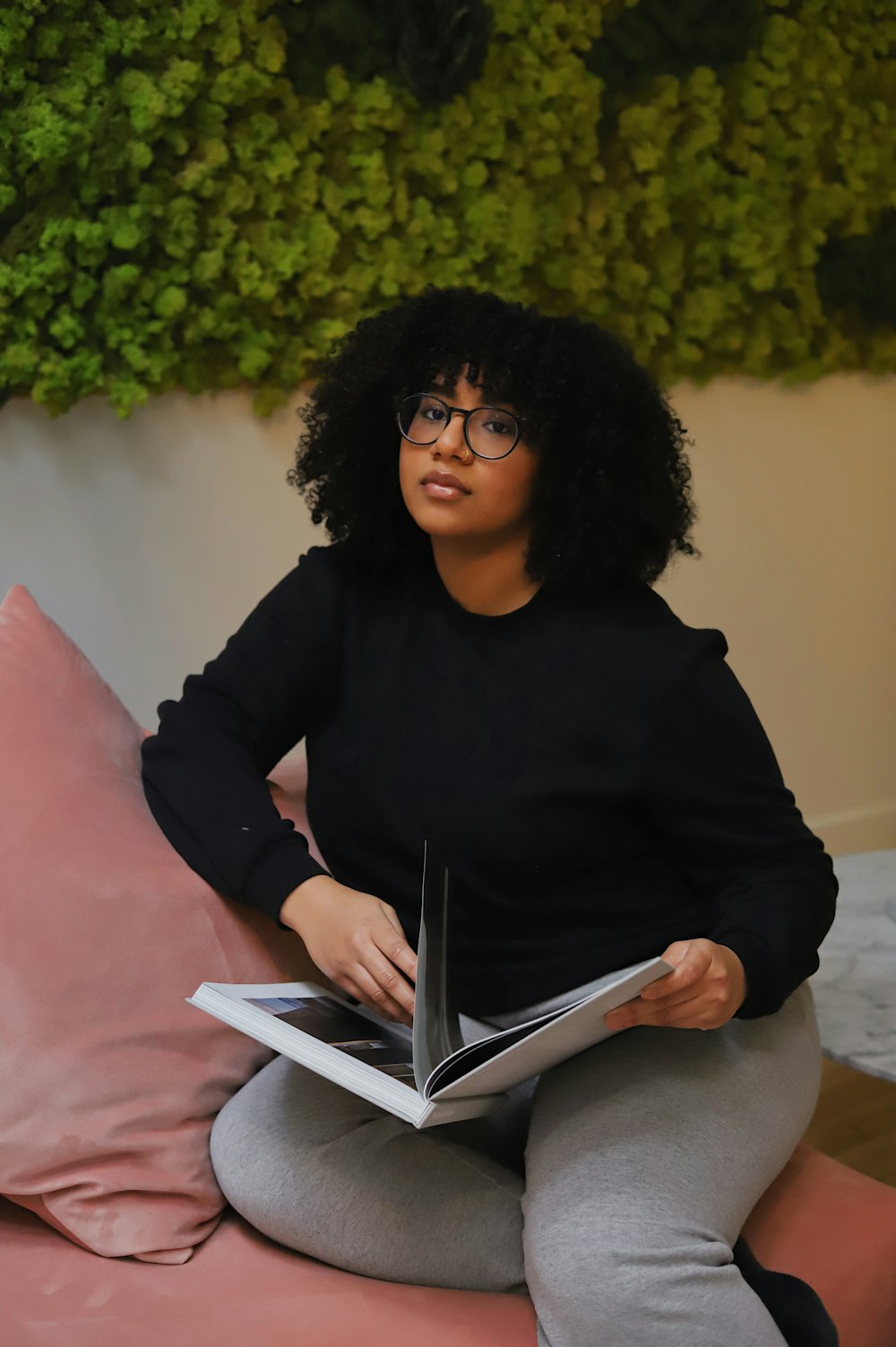 woman in black long sleeve shirt wearing black framed eyeglasses