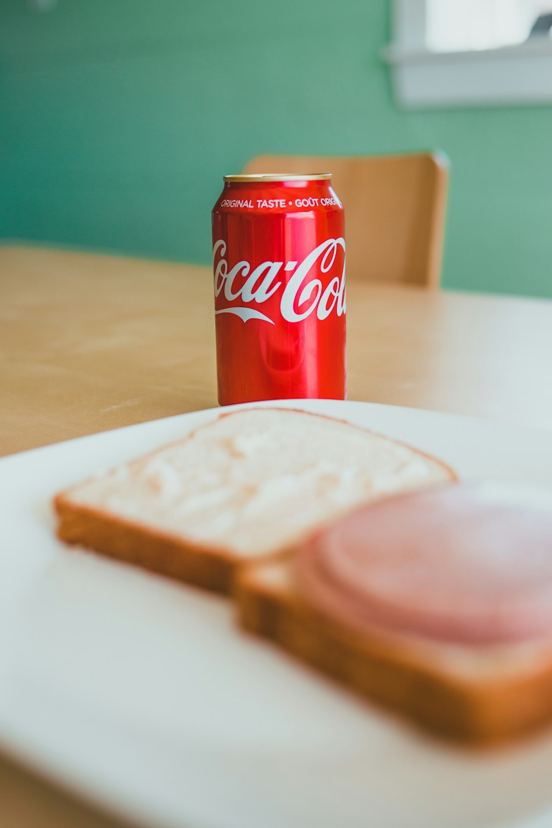 coca cola can on white table