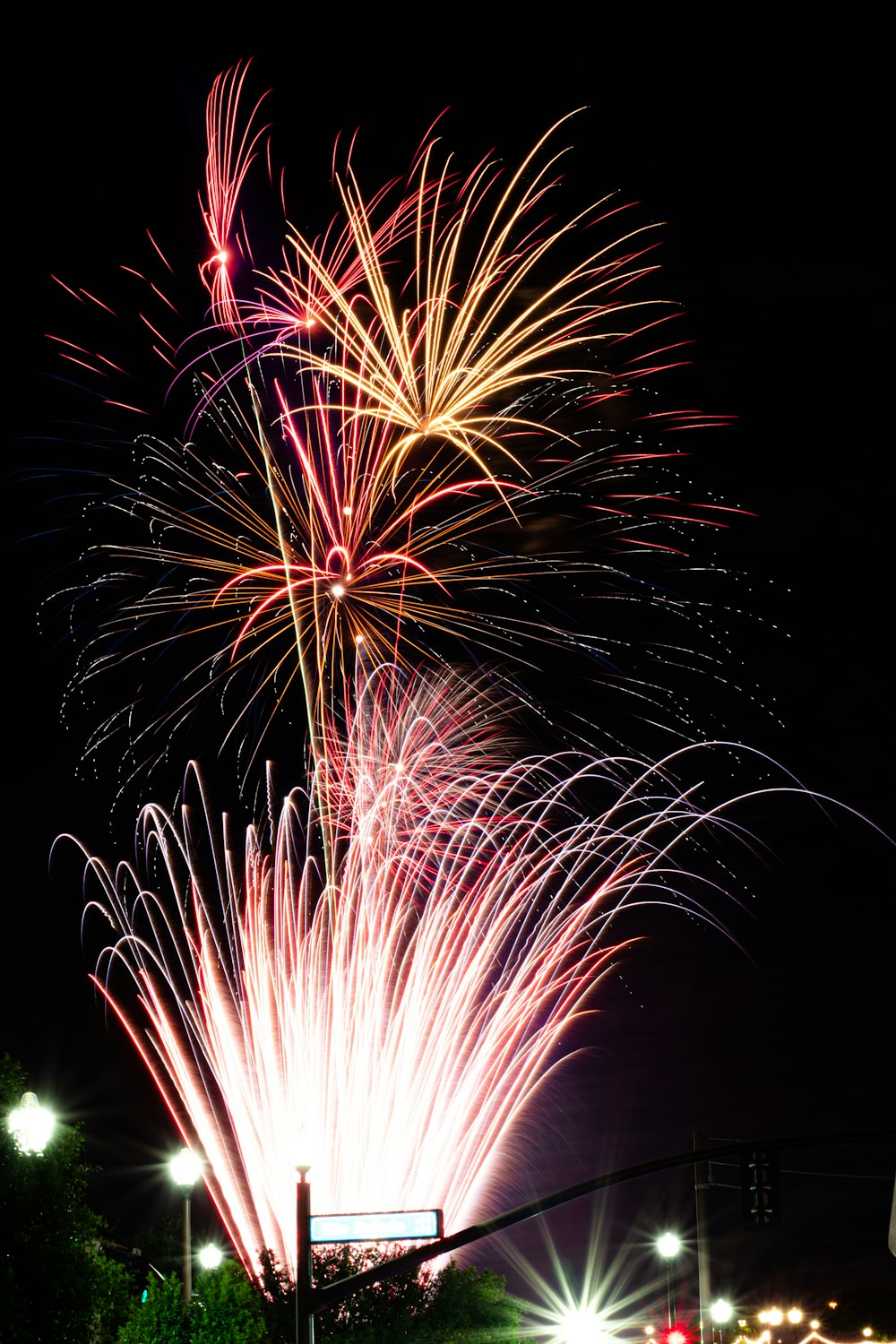 a bunch of fireworks are lit up in the night sky