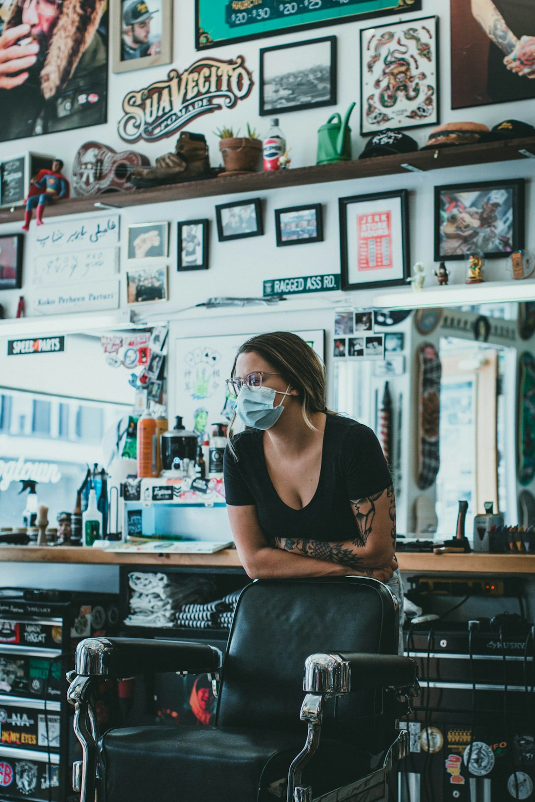 woman in black scoop neck shirt sitting on black leather chair