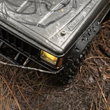 A completed miniature military jeep with intricate decals and customized accessories.