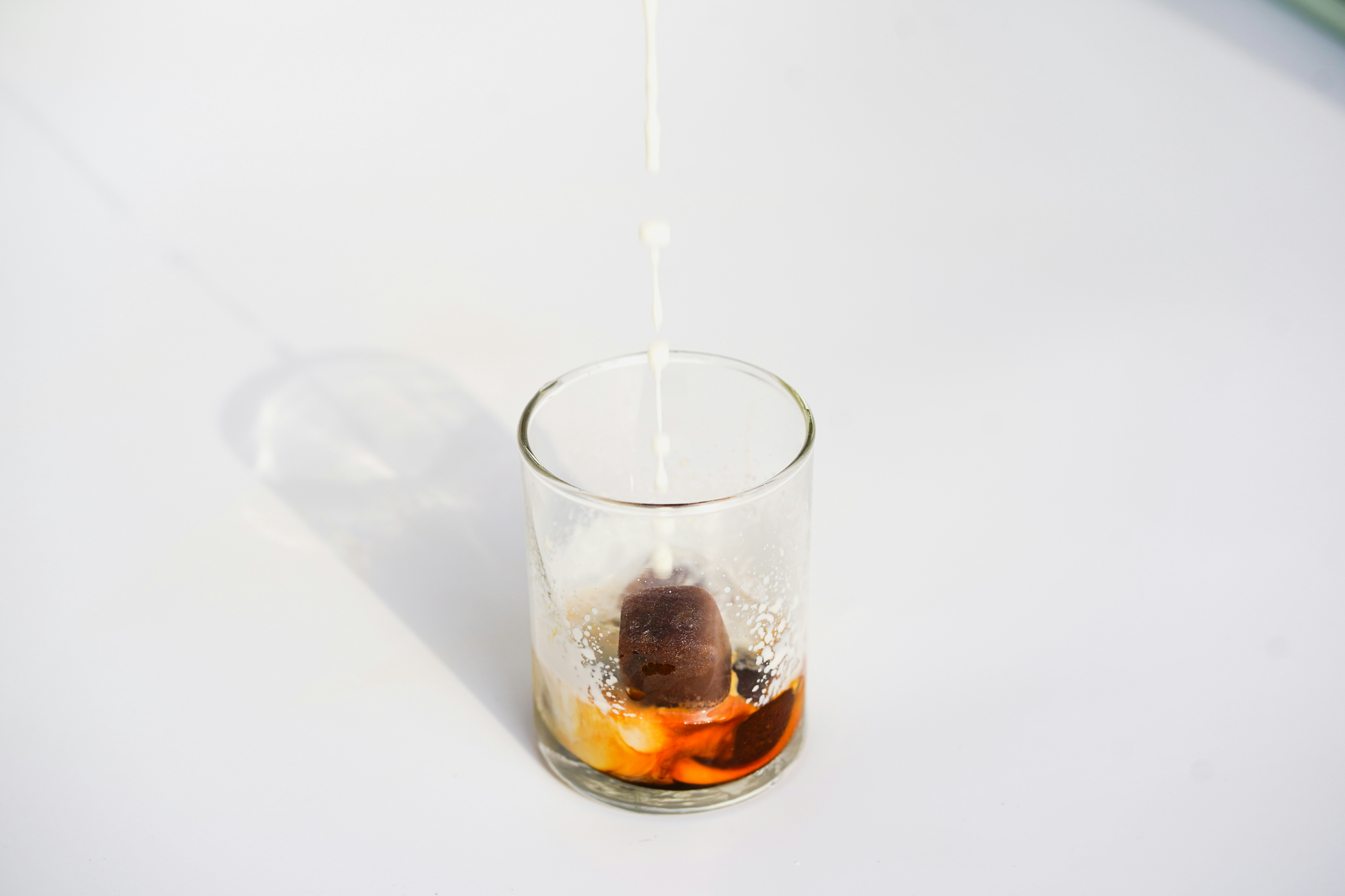 rusty water sample in a glass - Repiping services Littleton