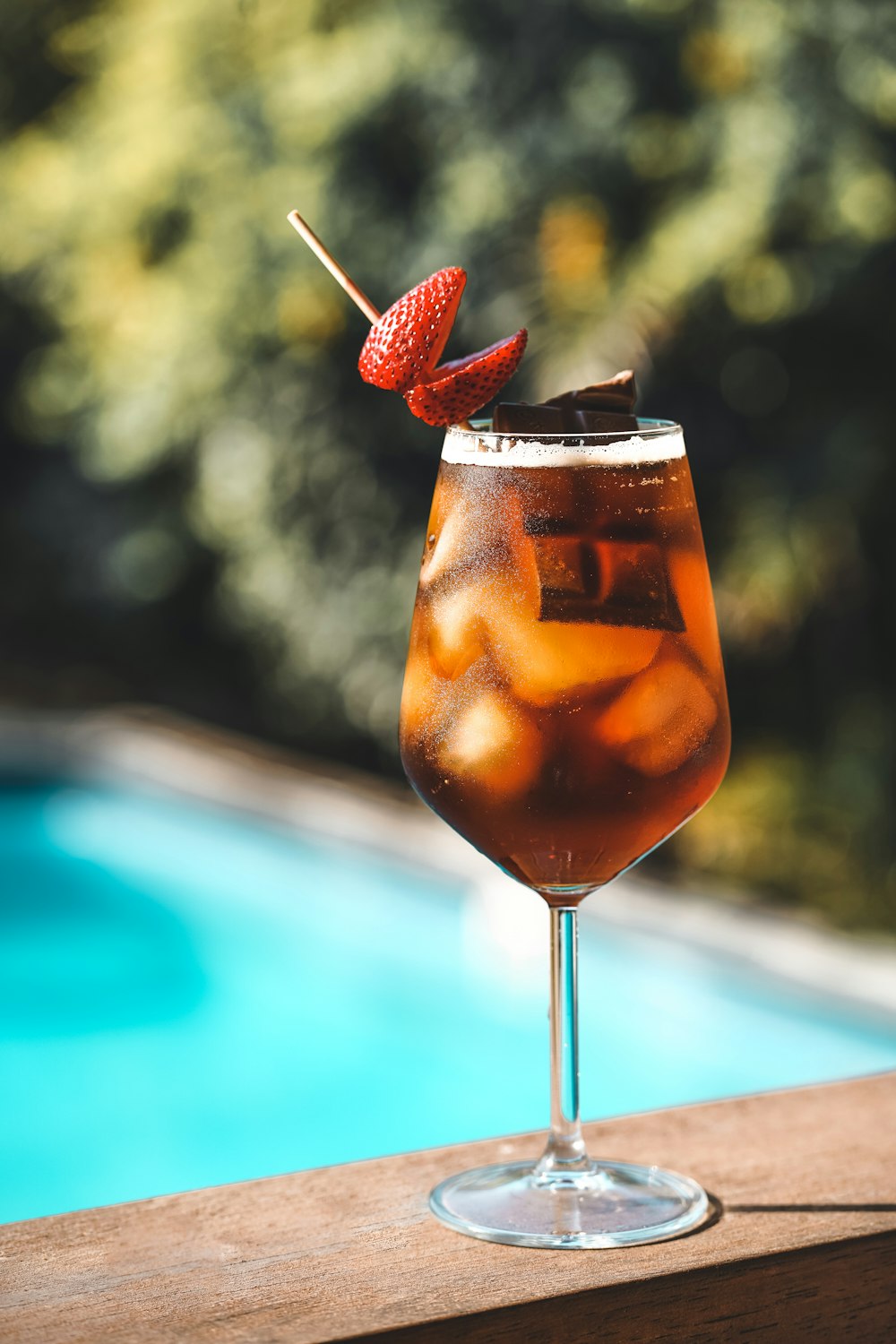 clear wine glass with brown liquid