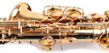 A close-up view of a brass saxophone showcasing intricate mechanical components and shiny golden surfaces.
