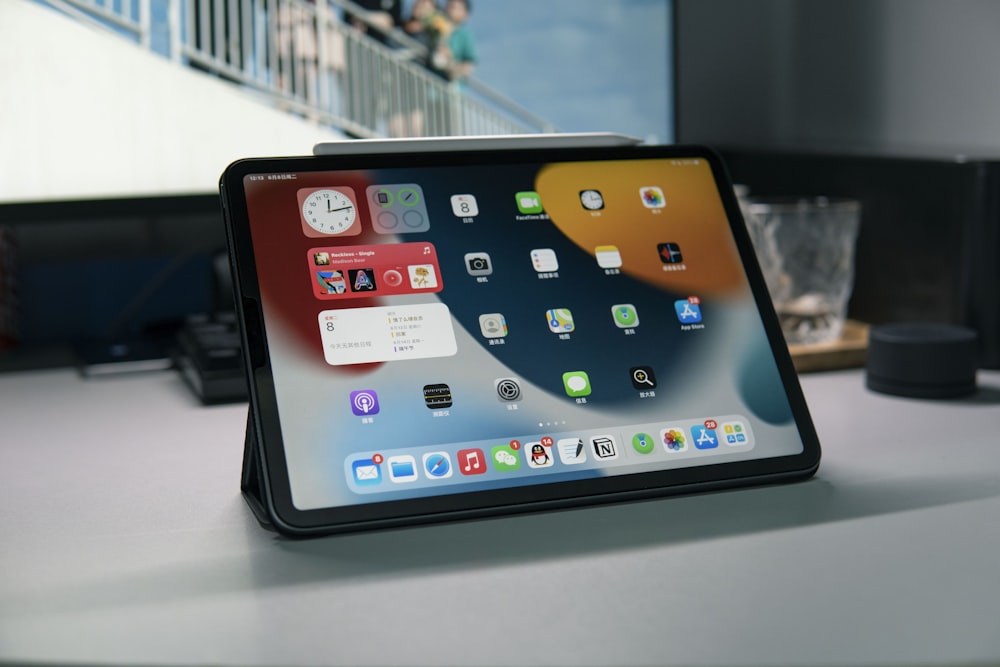 a tablet computer sitting on top of a table