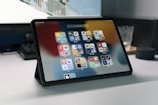 a tablet computer sitting on top of a table