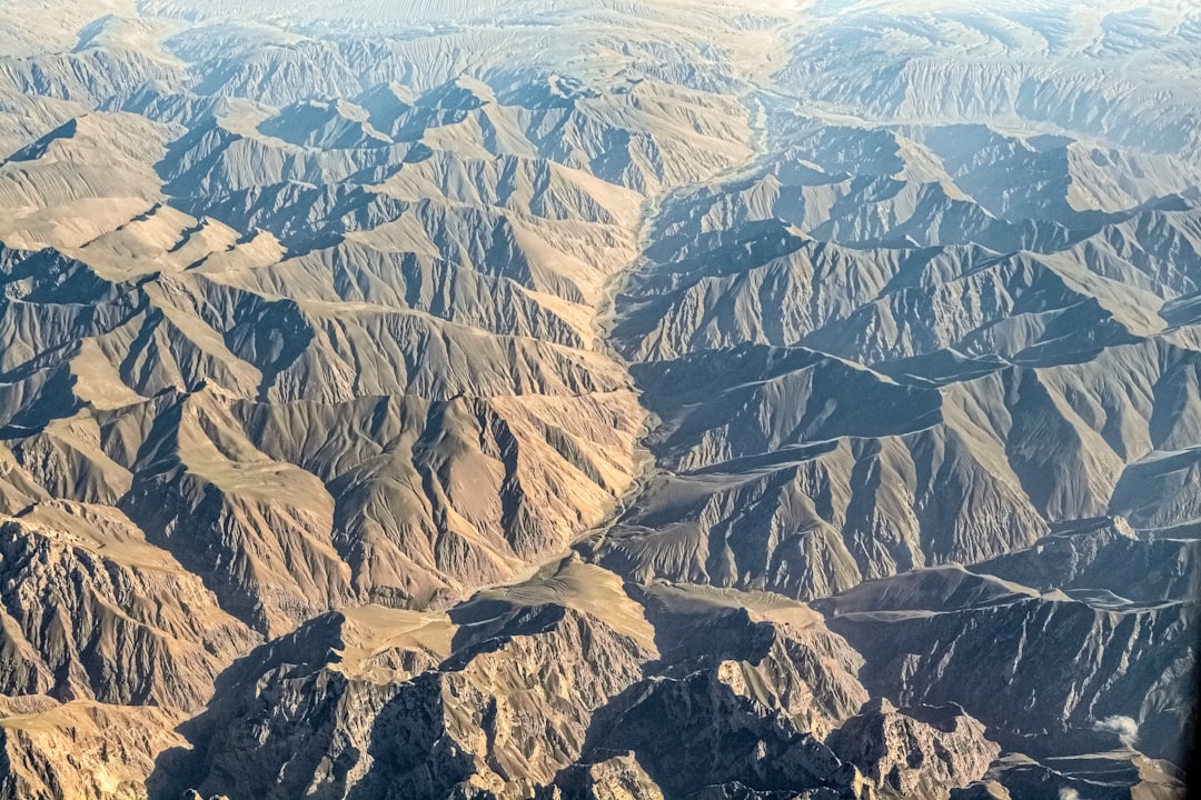 brown and gray mountains under blue sky during daytime