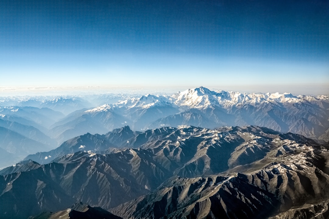 snow covered mountains under blue sky during daytime