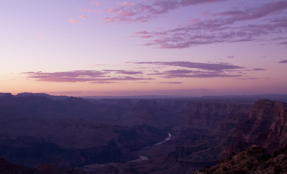 The sun is setting over a canyon with a river running through it photo –  Free Arizona Image on Unsplash