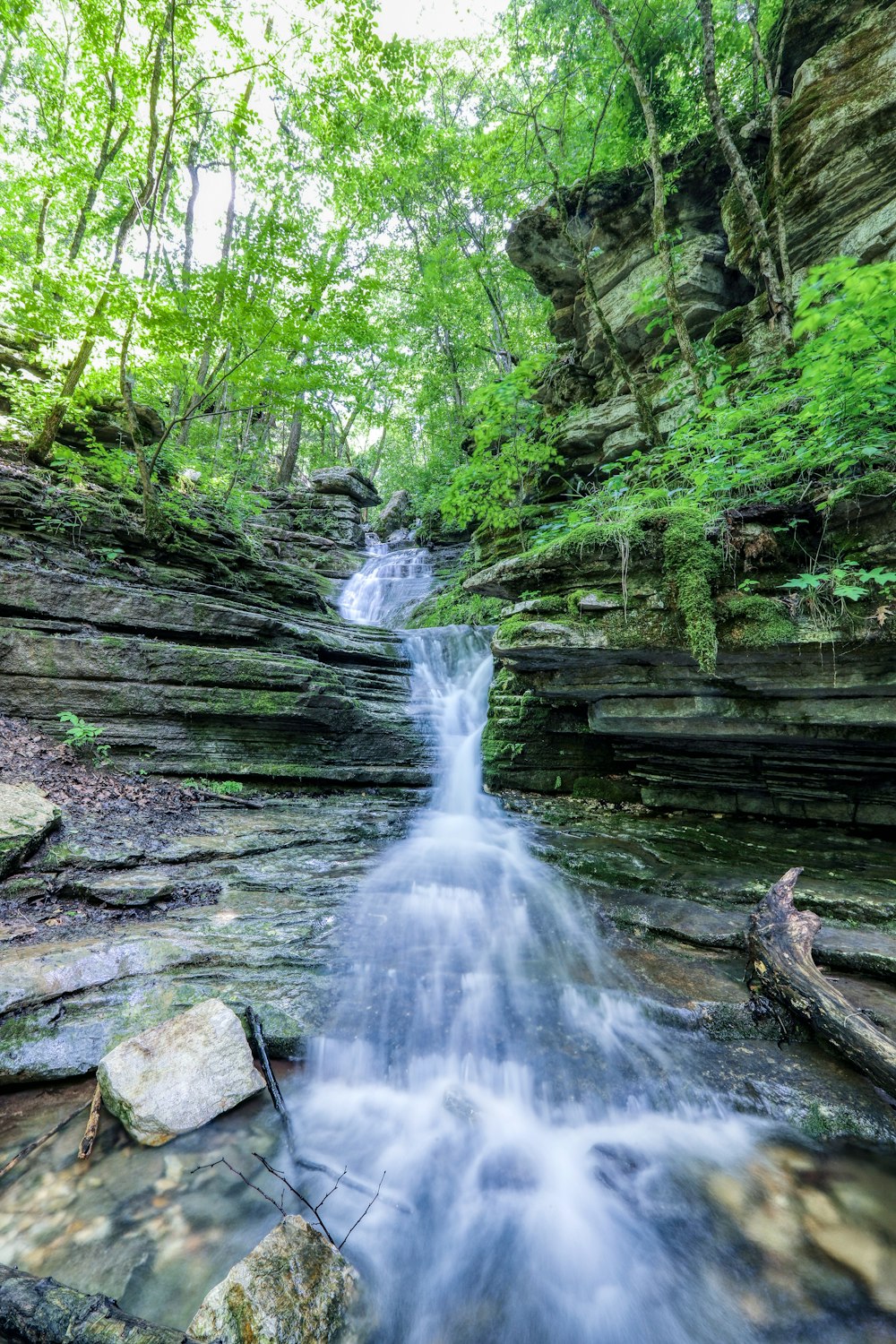 water falls on brown rock