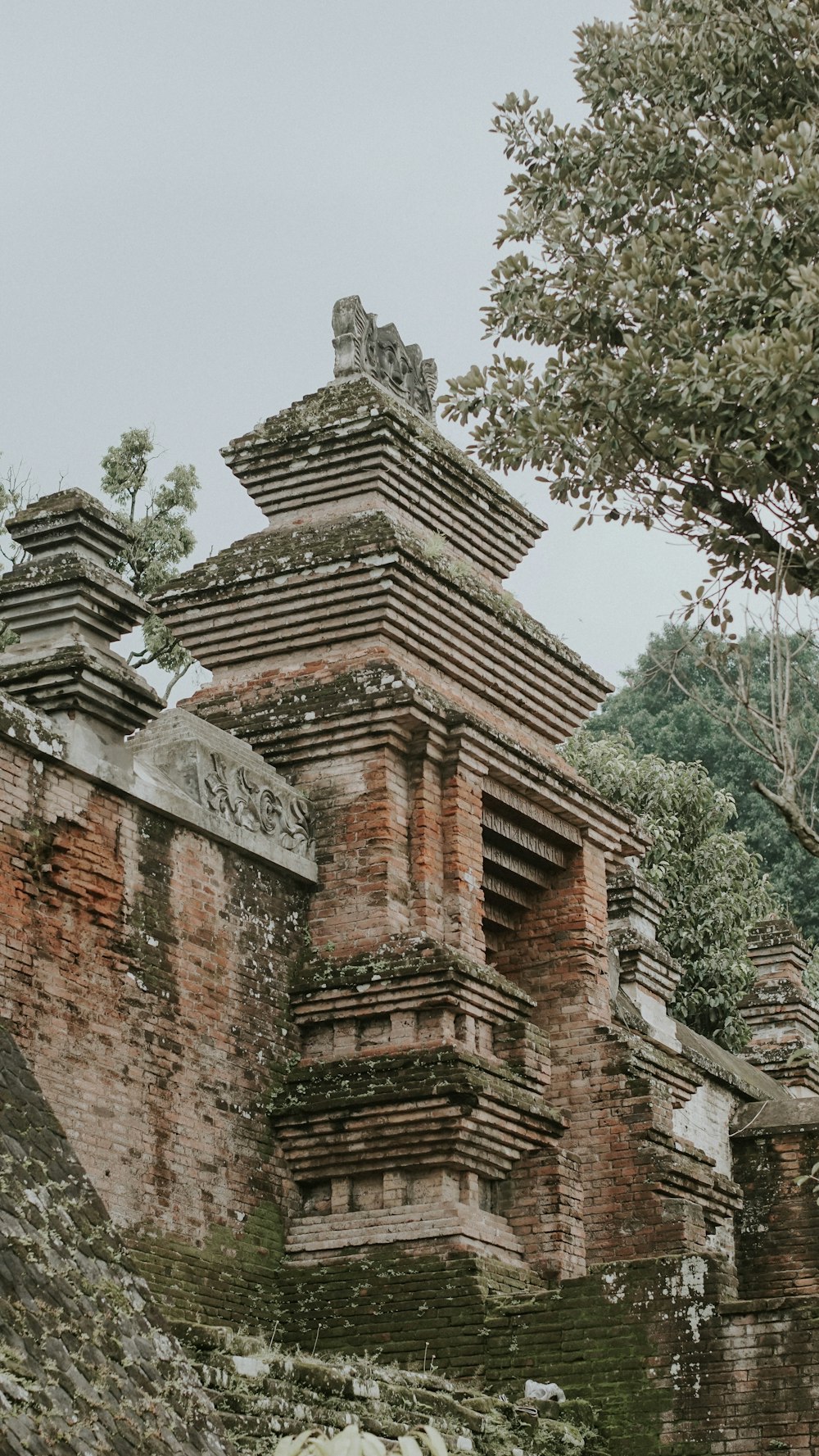 a stone structure with a clock on top of it