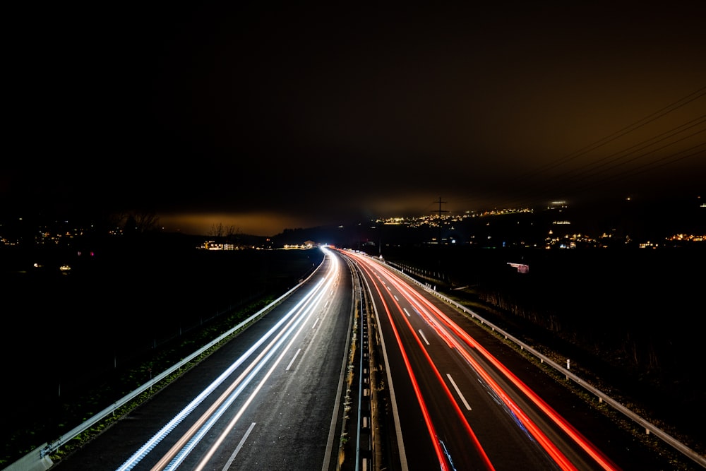 a long exposure shot of a highway at night