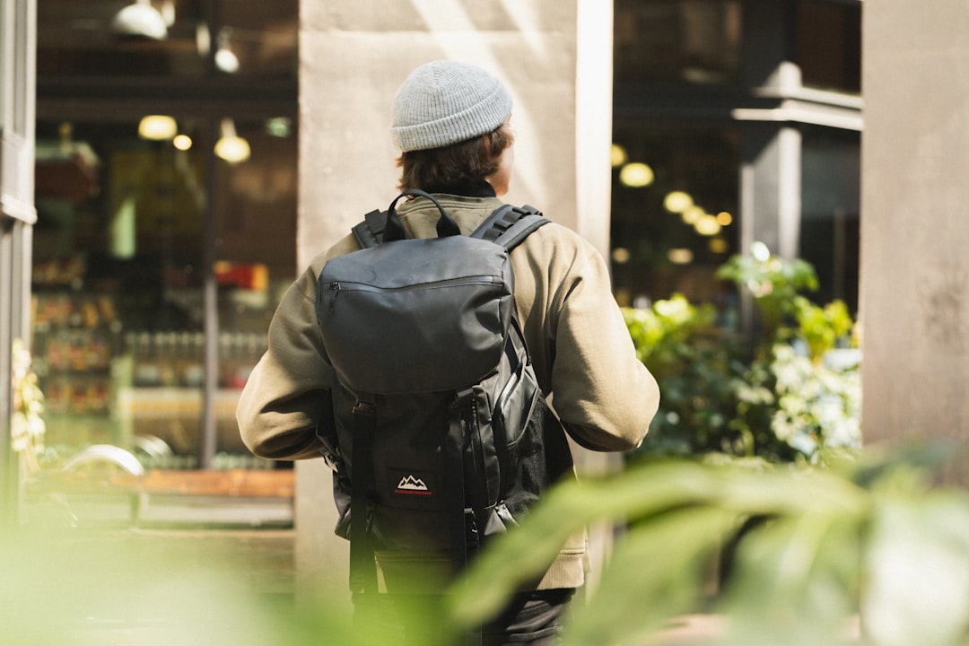 man in gray jacket and gray knit cap