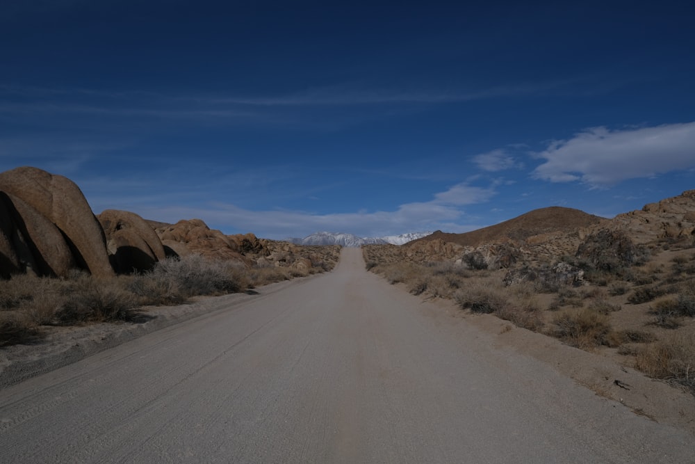 a dirt road in the middle of a desert