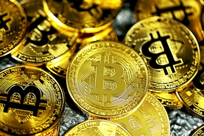 a pile of gold bitcoins sitting next to each other