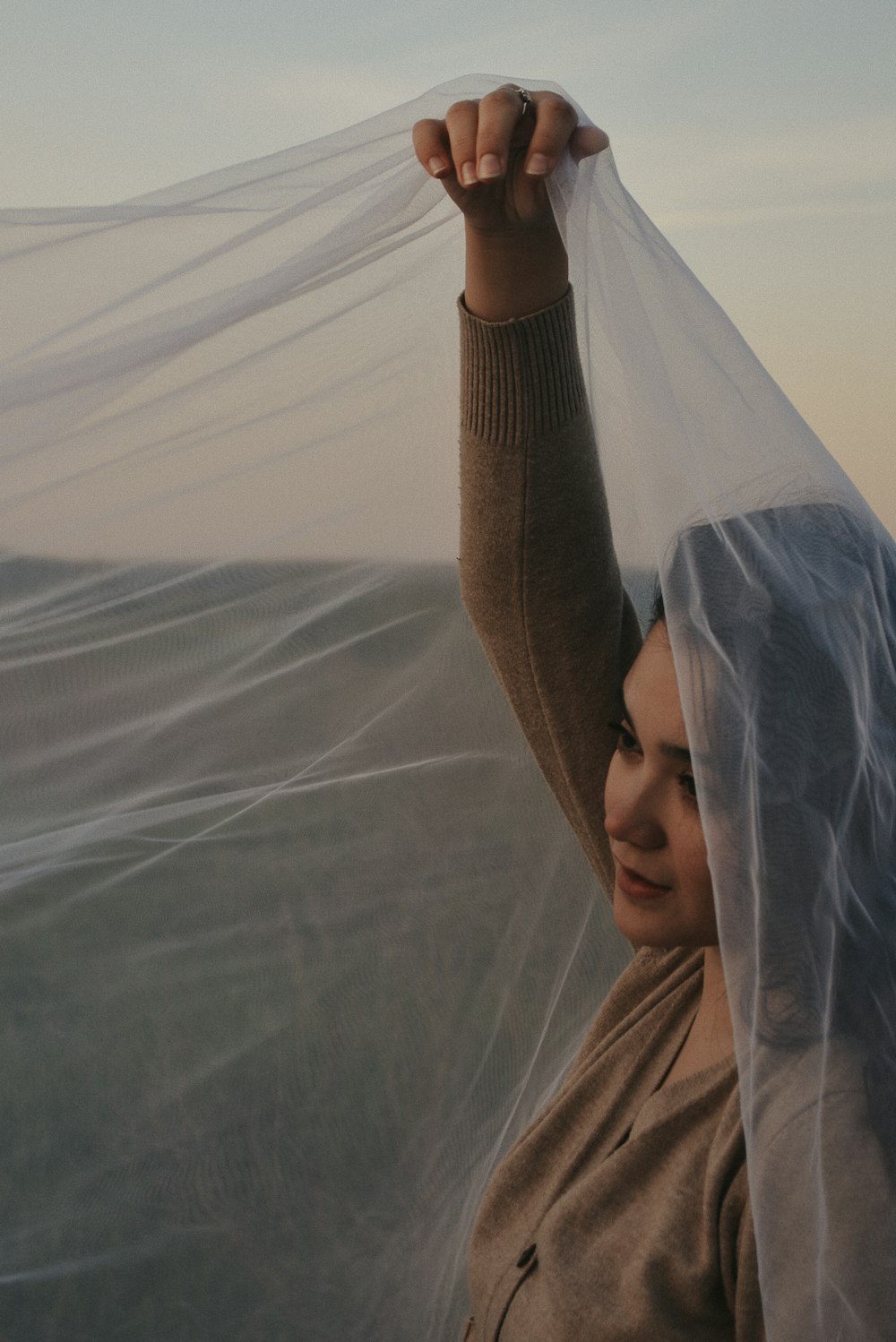 a woman with a veil over her head