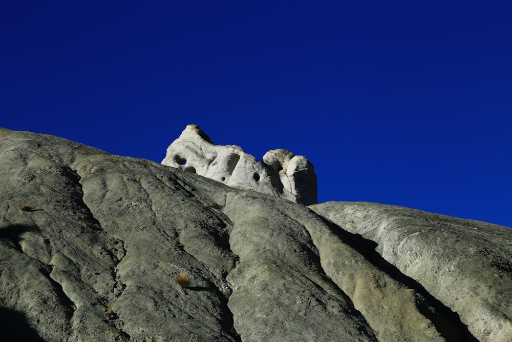 white and black rock formation under blue sky during daytime