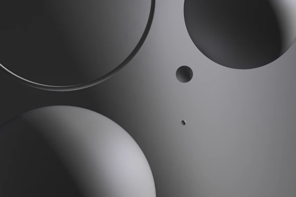 Close-up of a professional business website layout in black and dark gray tones with silver highlights