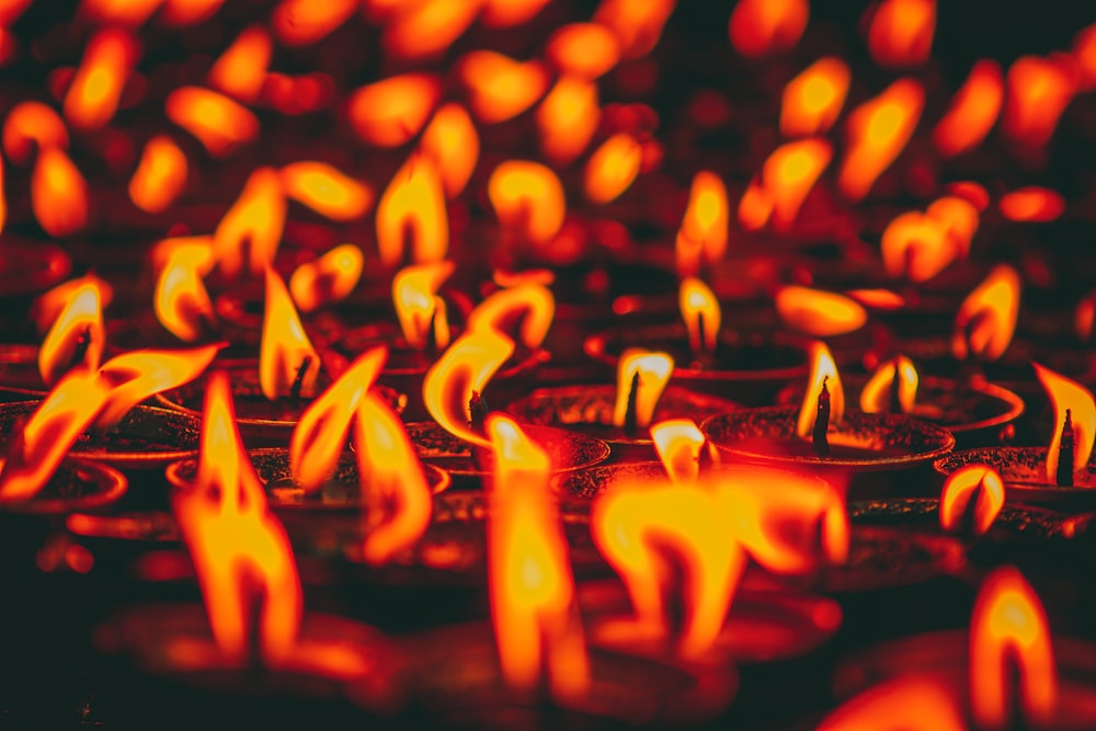 lighted candles on black surface