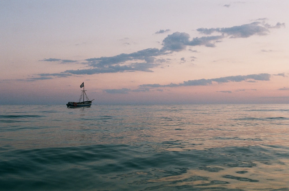 boat on sea during sunset