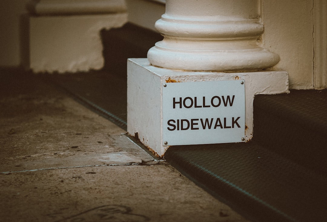 white and black wooden signage