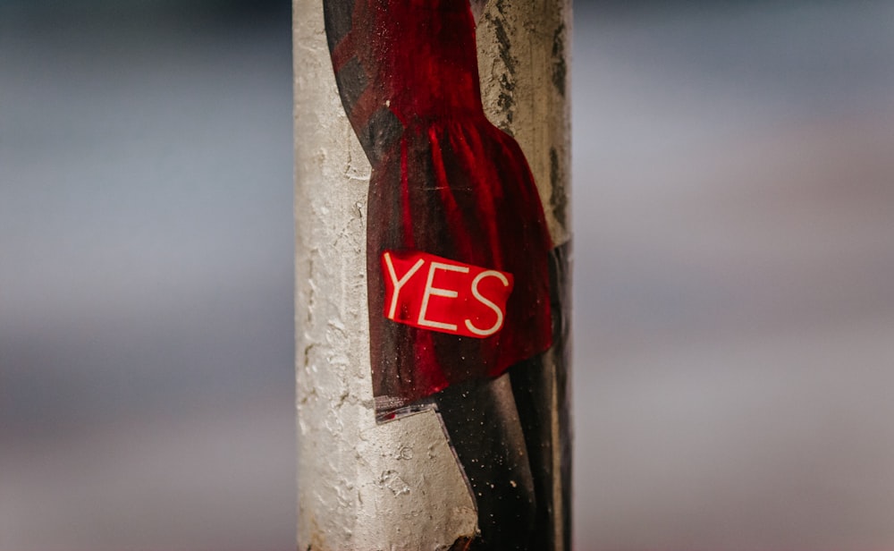 coca cola bottle on brown wooden post