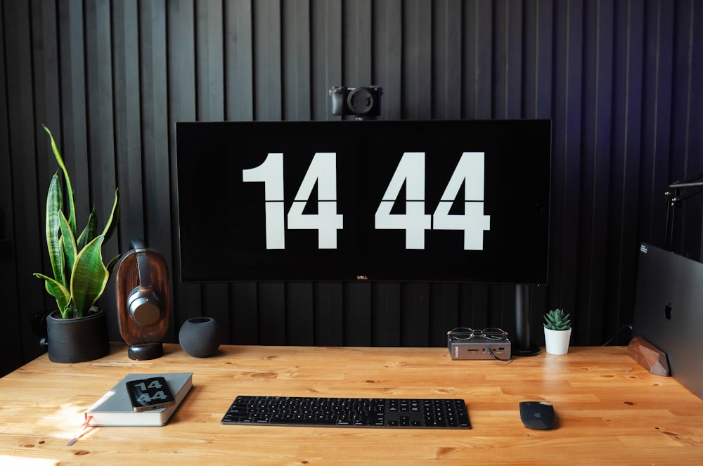 a desk with a computer, keyboard and mouse on it