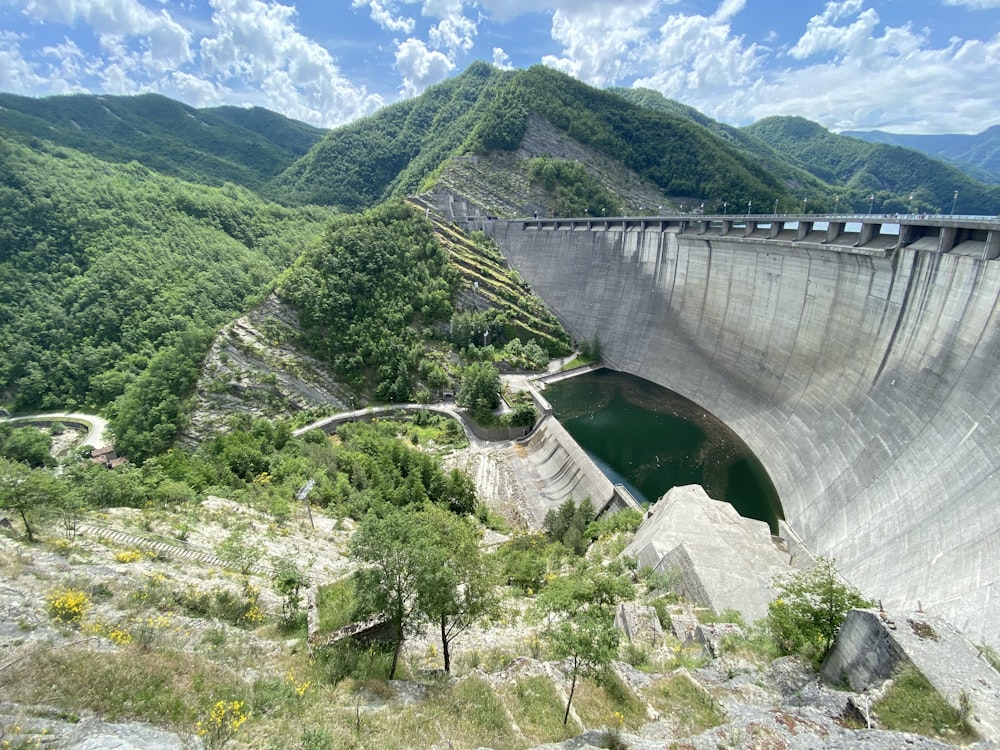 a view of a dam in the middle of a mountain range