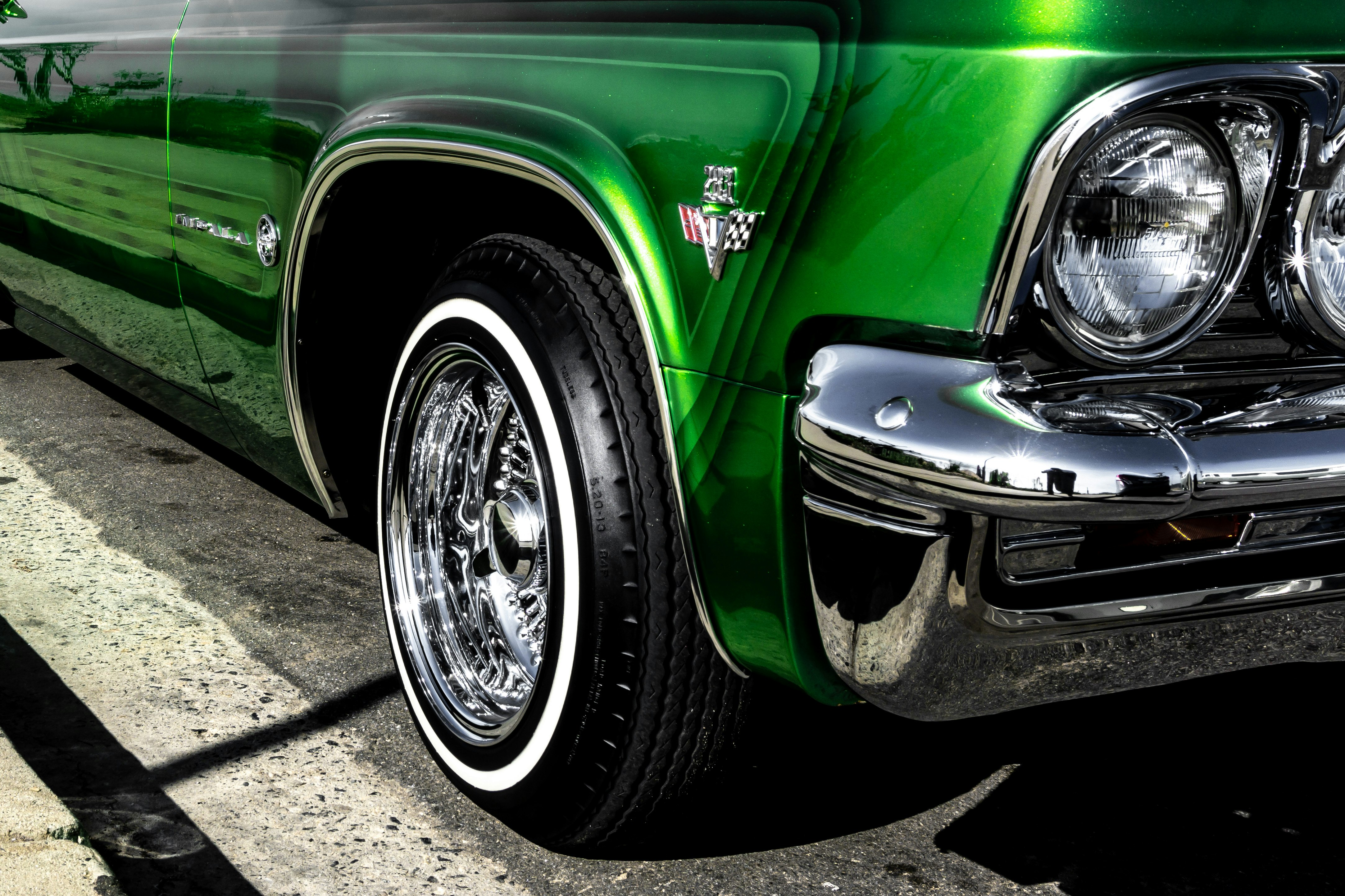 green car with chrome wheel