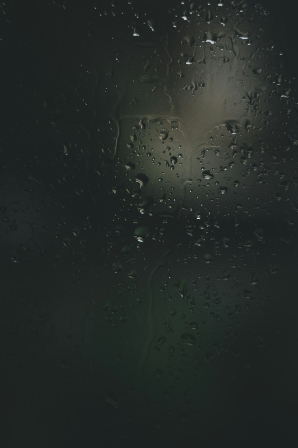 a window with rain drops on it